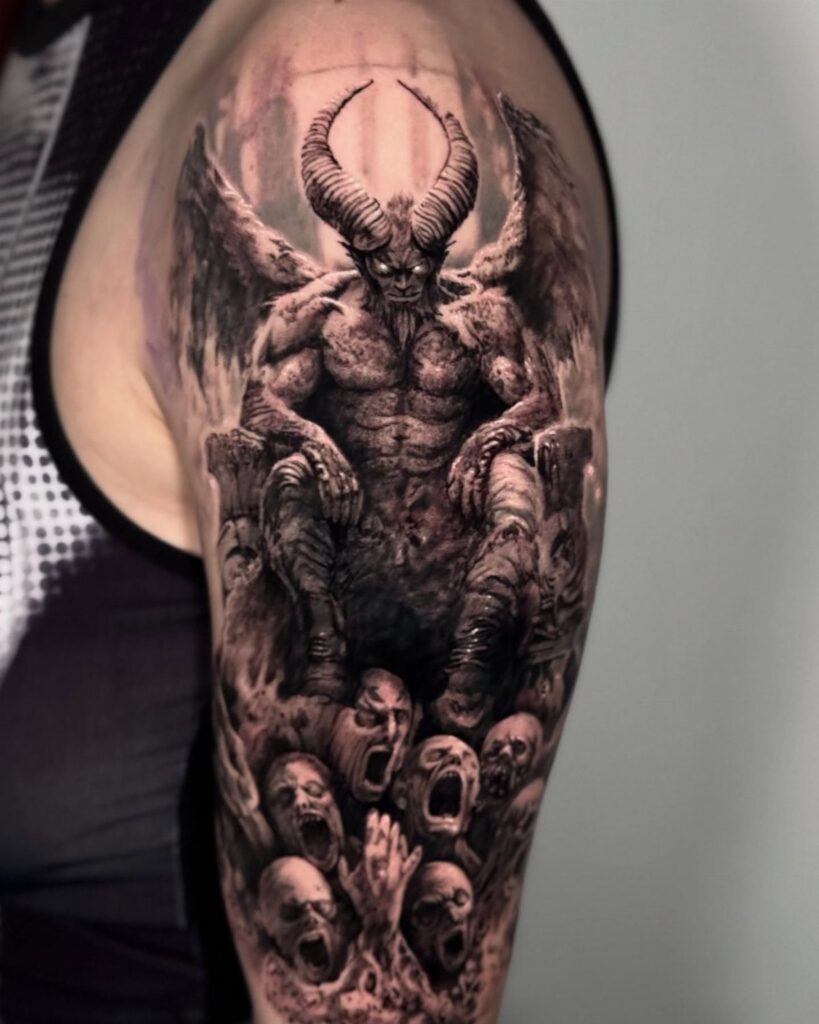 Horned demon tattoo on a man's arm with screaming souls and skulls below.